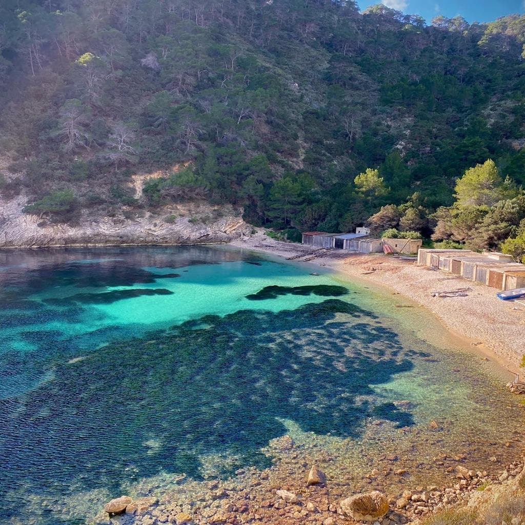 Hidden beaches in Ibiza with clear water and rocky coastline
