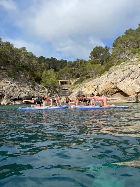 SUP yoga session on calm water in Ibiza